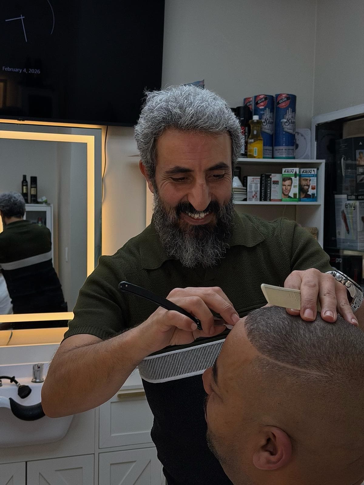 Master barber creating artistic hair design at Ocean Manor Barbershop Fort Lauderdale